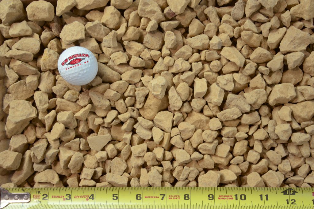 .75" limestone clear shown with a measuring tape and golf ball for size comparison