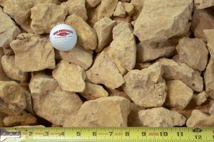 3" limestone clear shown with a measuring tape and golf ball for size comparison