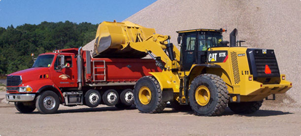 Wm. Mueller & Sons front end loader filling a road construction truck