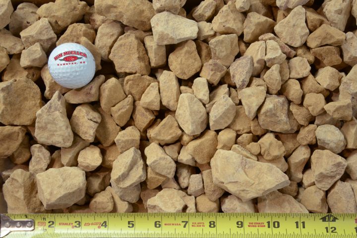 1/5" limestone clear shown with a measuring tape and golf ball for size comparison